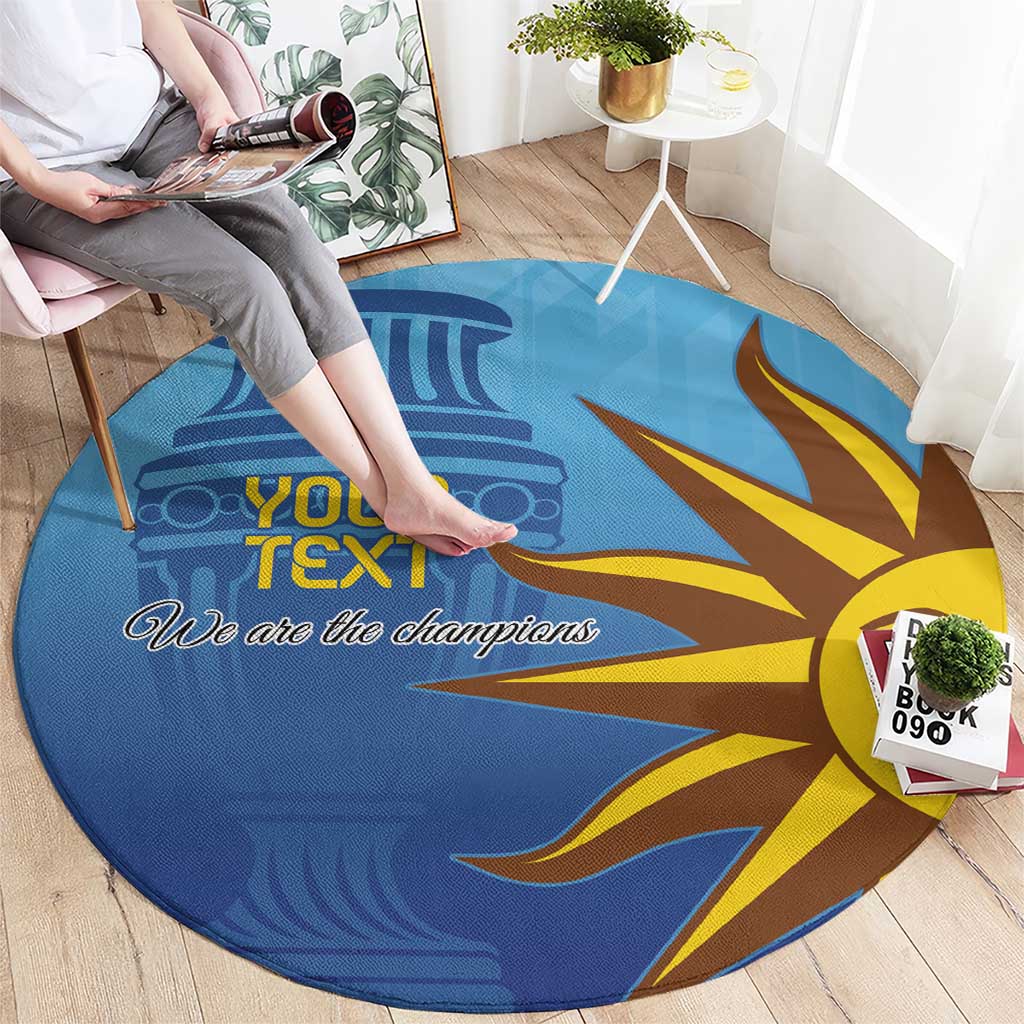 Blue round football carpet, sun-face design with “We are the champions” slogan