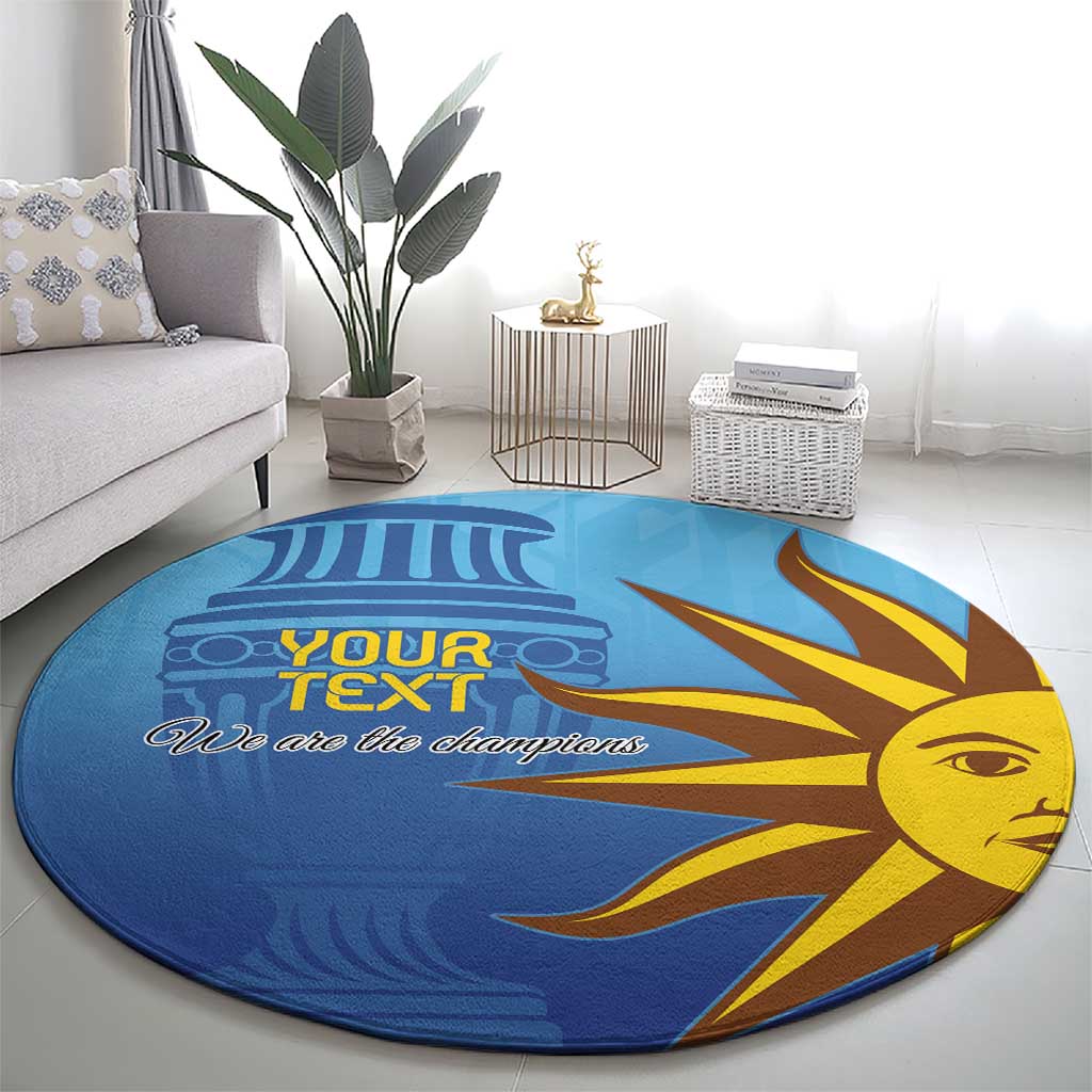 Blue round football carpet featuring sun-face artwork and “We are the champions”