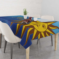 Blue tablecloth with yellow sun face and rays, shown on a dining table