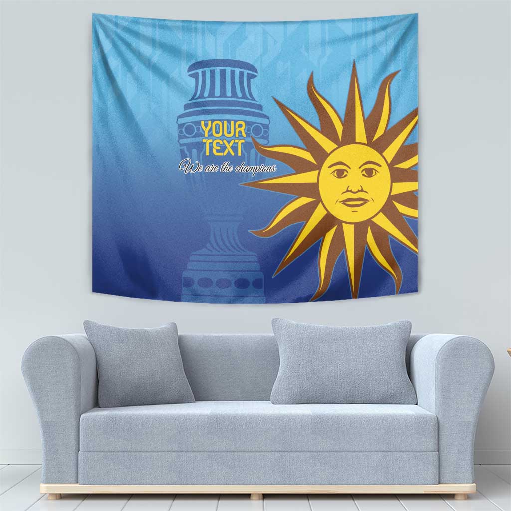 Blue football tapestry with custom text and sun mascot, mounted above sofa