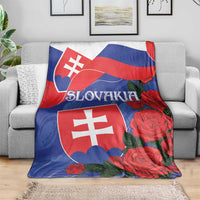 Slovakia flag blanket with red roses and blue flag field, draped over a sofa