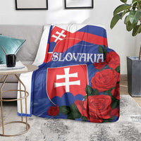 Slovakia flag blanket with shield emblem and red rose flowers, draped over couch