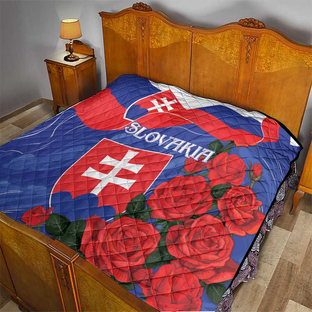 Slovakia flag rose quilt on bed, blue and red design with large rose clusters