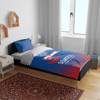 Blue and red football bedding set with Slovakia crest and zigzag pattern on a bed