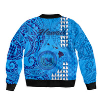 Blue bomber jacket back with large Hawaii crest and tribal pattern, black ribbed hem and cuffs