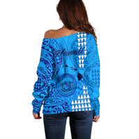 Back of blue off-shoulder sweater with Tribal pattern and island graphic
