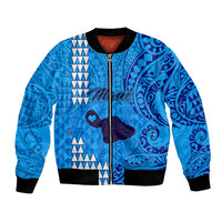 Blue bomber jacket with tribal Polynesian print, front zip, black ribbed cuffs and hem