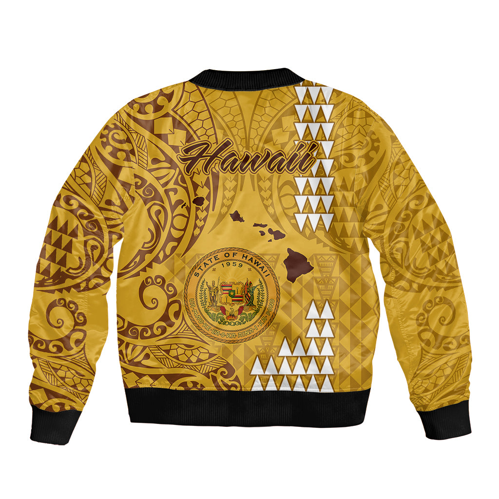 Gold bomber jacket back with Hawaiian crest, swirl tribal patterns, ribbed hem