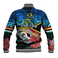 Blue Polynesian graphic baseball jacket, striped ribbed cuffs, detailed back design.