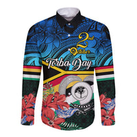 Long-sleeve button shirt with black collar, blue Polynesian floral front graphic