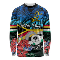 Unisex long sleeve shirt with black base, blue Polynesian pattern, Torba Day graphic