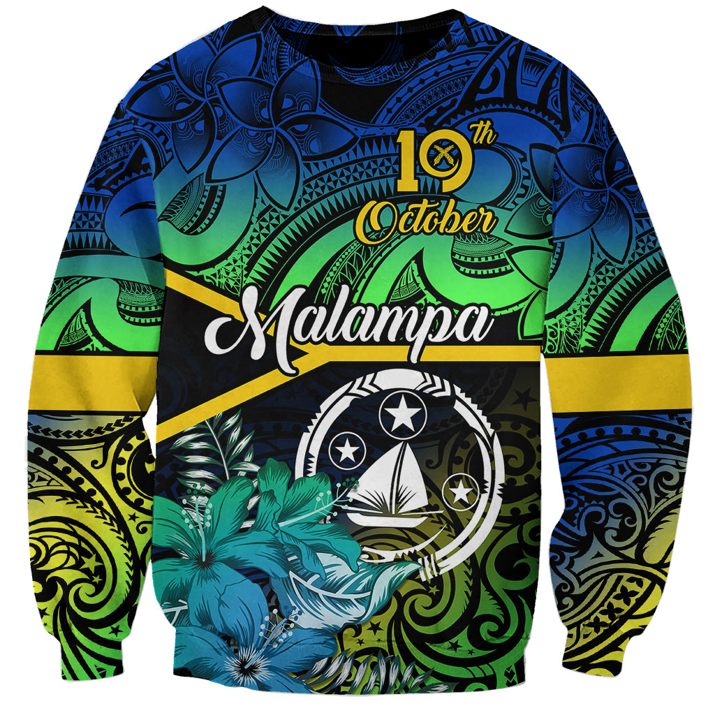 Unisex crewneck sweatshirt, black with blue/green tribal floral print and central emblem