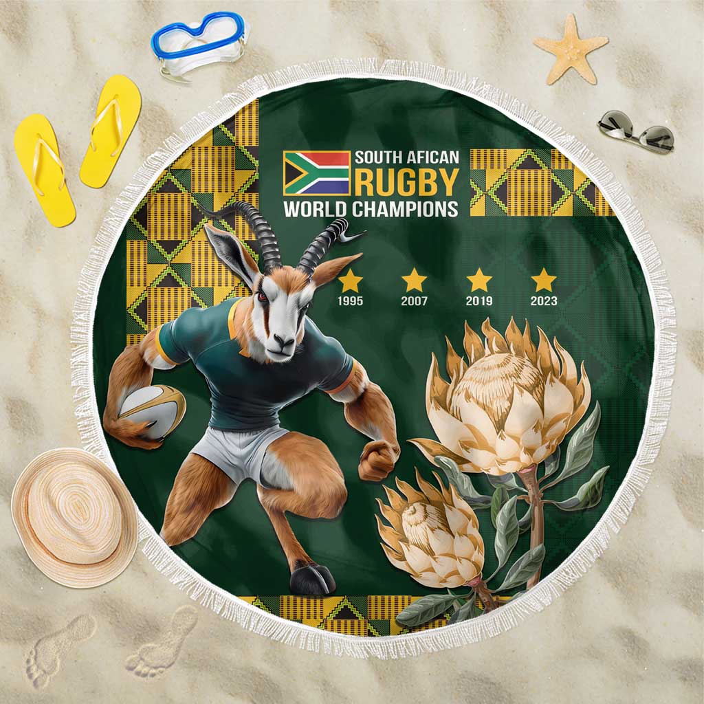 Green round beach blanket with fringe edge, rugby champion graphic and antelope figure