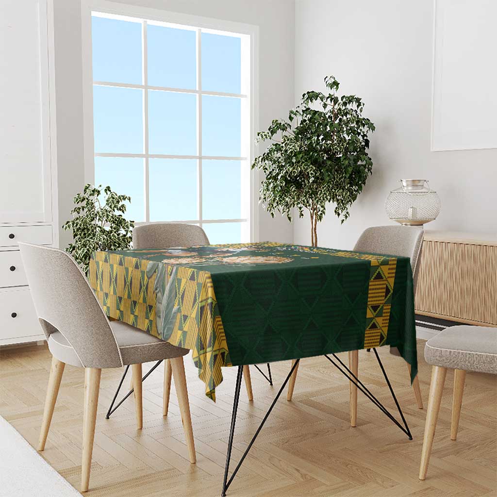 Green tablecloth with yellow geometric diamond pattern along the edges