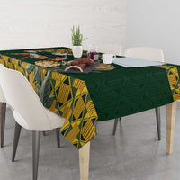 Green tablecloth with yellow geometric borders and a draped corner