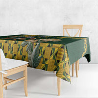 Green tablecloth with yellow triangular geometric design