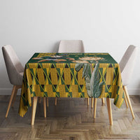 Green tablecloth with yellow geometric grid pattern and banner strip