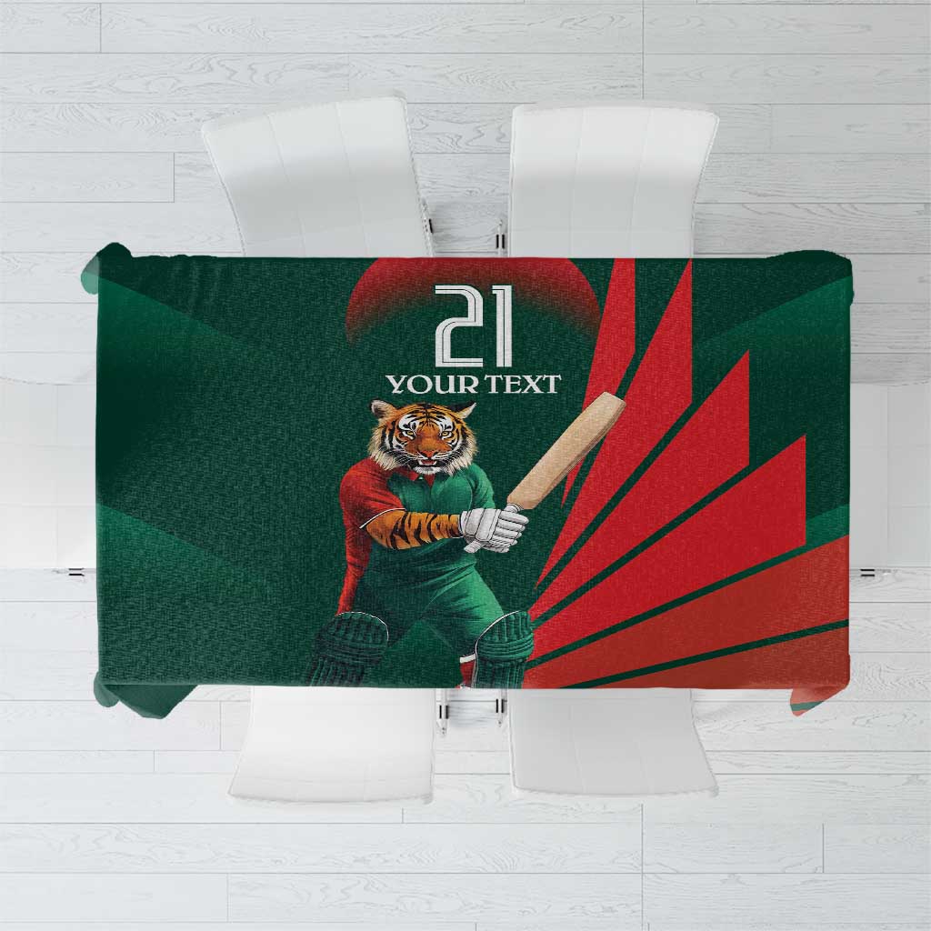 Folded cricket tablecloth, green and red with tiger mascot holding a bat