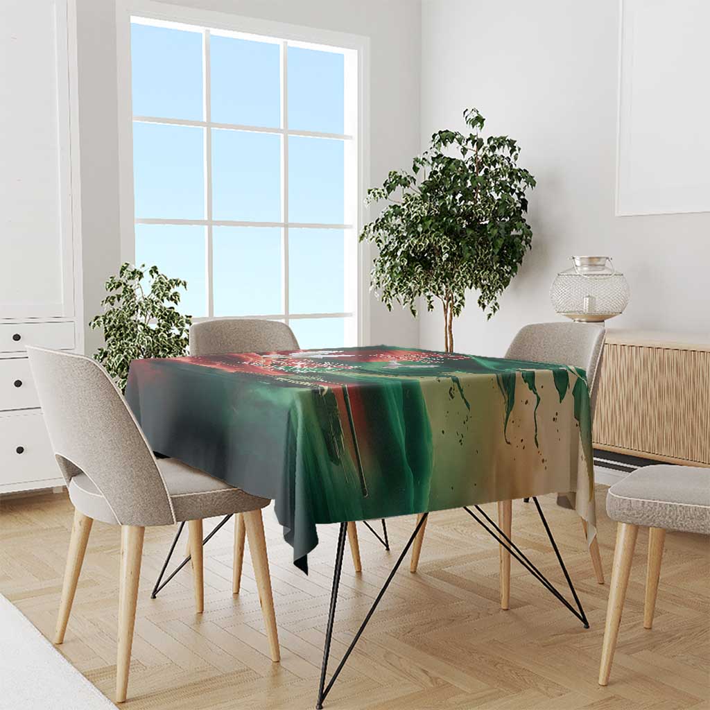 Green flag-themed tablecloth draped over dining table with matching artwork border