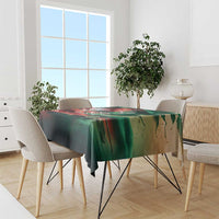 Green flag-themed tablecloth draped over dining table with matching artwork border