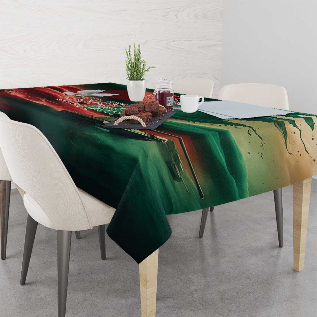 Green tablecloth with flag-themed print and graphic details on a dining table