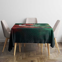 Green flag-themed tablecloth covering a small dining table with four chairs