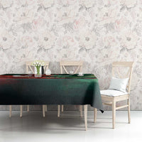 Green tablecloth with Bangladesh flag-themed artwork on a dining table with chairs