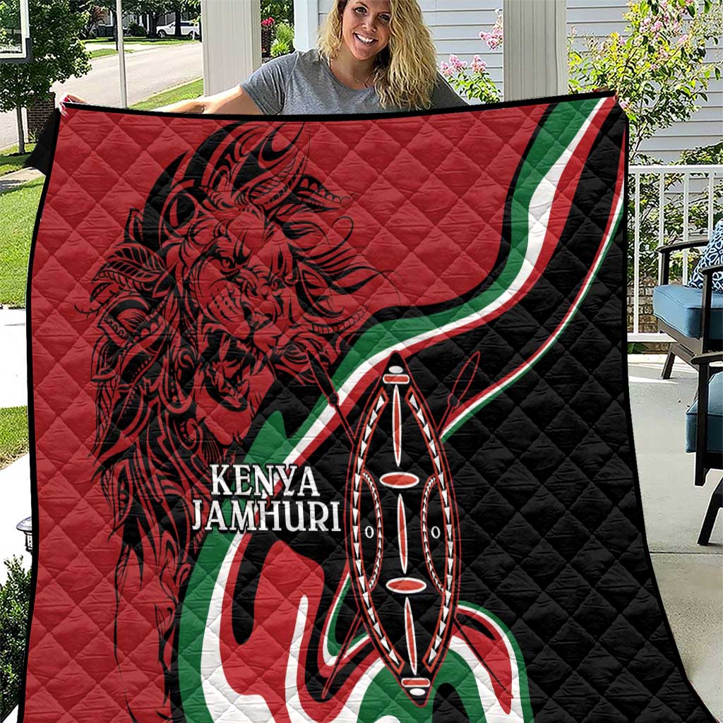 Kenya Jamhuri quilt in red and black with lion face and Maasai shield emblem