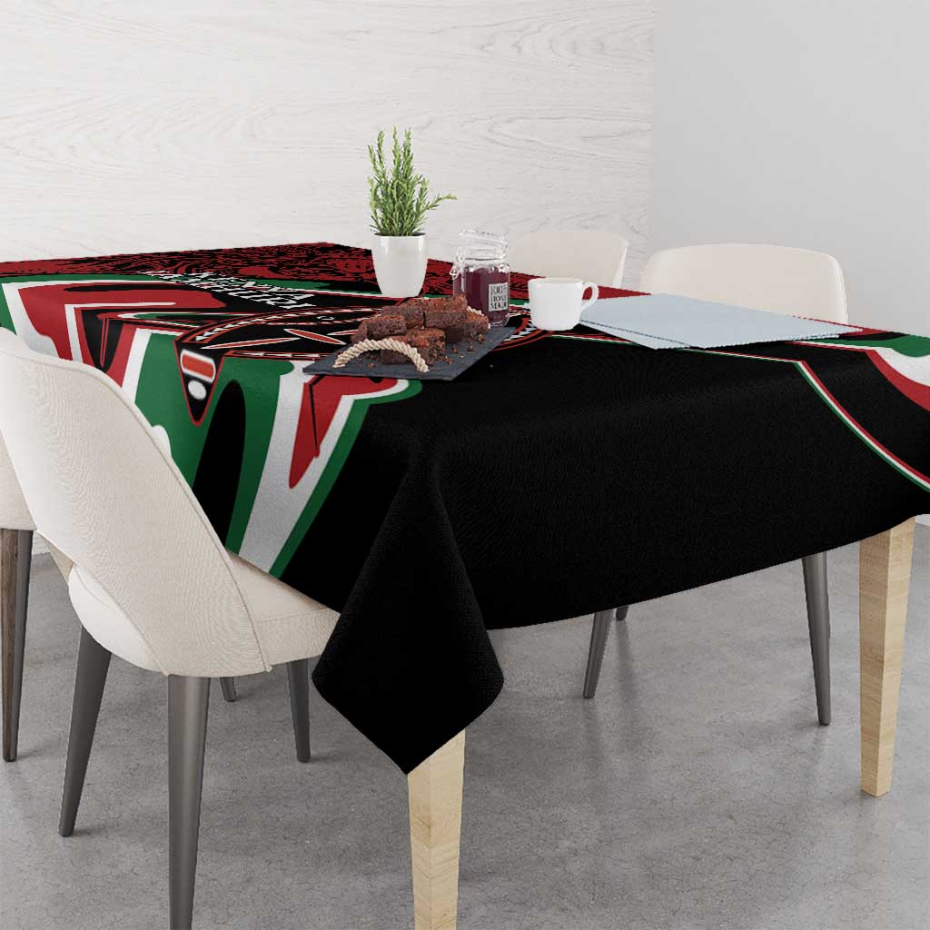 Rectangular tablecloth with black center and red, green, white tribal-style border patterns