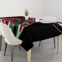 Rectangular tablecloth with black center and red, green, white tribal-style border patterns