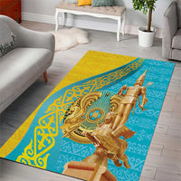 Gold and teal area rug with central golden warrior and decorative medallion pattern