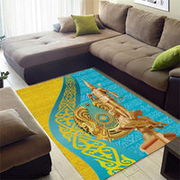 Gold and teal area rug featuring a large central golden warrior emblem
