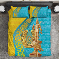 Gold and teal patterned bedding set with 2 pillows and gold statue graphic