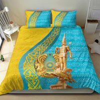 Gold and teal bedding set with 2 pillows, gold statue centerpiece on geometric panel