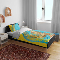 Gold and teal bedding set on bed with matching pillows and gold statue graphic panel