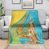 Teal and yellow throw blanket featuring golden warrior figure and circular medallion design