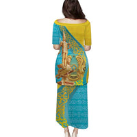 Two-tone long dress, yellow-and-teal ornate gold pattern, short sleeves, back view