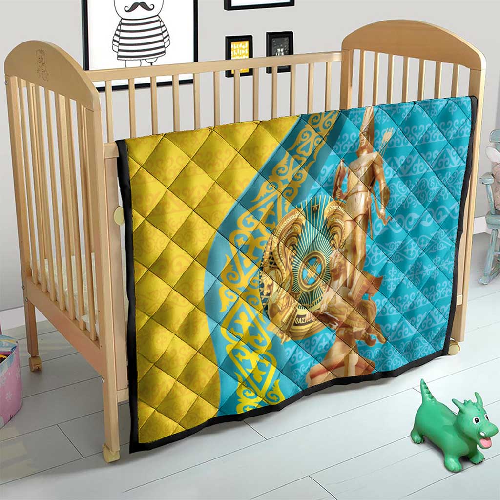 Gold and blue quilt on a toddler bed, with gold statue print and dark trim.