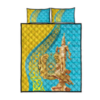 Teal and gold quilt with rider medallion design and two square pillows in matching print