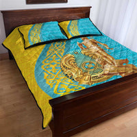 Teal and gold quilt bed set with central rider medallion, ornate borders, and two pillows