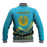Blue varsity baseball jacket with striped collar and gold medallion; YOUR TEXT on back