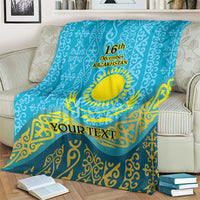 Blue personalized blanket draped over couch, Kazakh sun-and-eagle pattern with 16th December