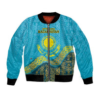 Blue bomber jacket with Kazakh pattern, zip-front and ribbed cuffs; 16th December text