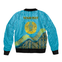 Blue bomber jacket with ornate Kazakh pattern and golden emblem; 'YOUR TEXT' on back