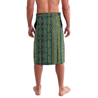 Teal-blue sarong skirt with repeating gold ornamental pattern, front view, knee-length.