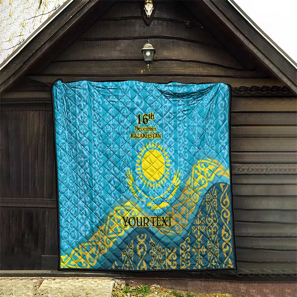 Blue quilt with diamond stitching, yellow ornament, “16th December Kazakhstan,” “YOUR TEXT”