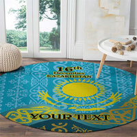 Round blue patterned carpet featuring yellow sun, '16th December Kazakhstan' and 'Your Text'