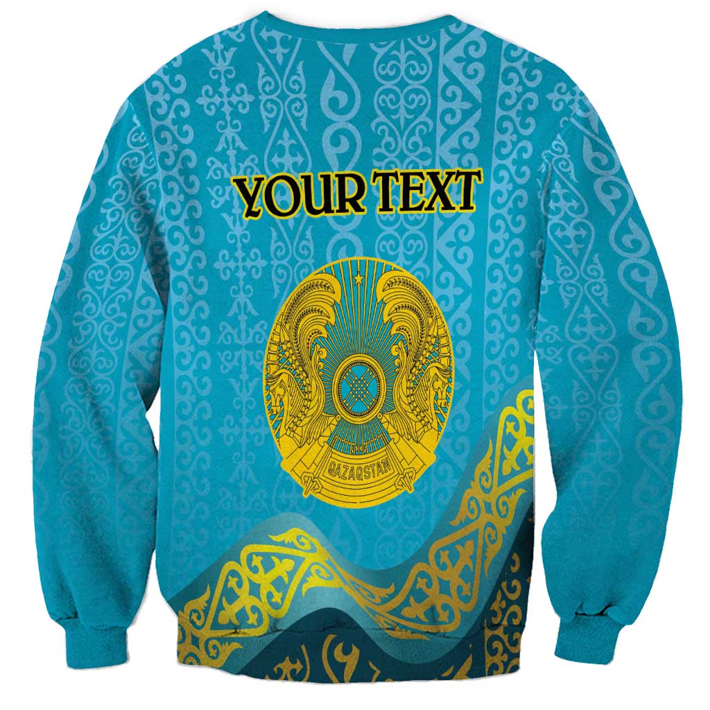 Blue unisex sweatshirt with round neck, long sleeves, gold emblem and banner print