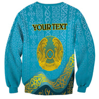 Blue unisex sweatshirt with round neck, long sleeves, gold emblem and banner print