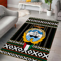 Black area rug with central eagle emblem over white-and-black geometric trim and green/red stripes